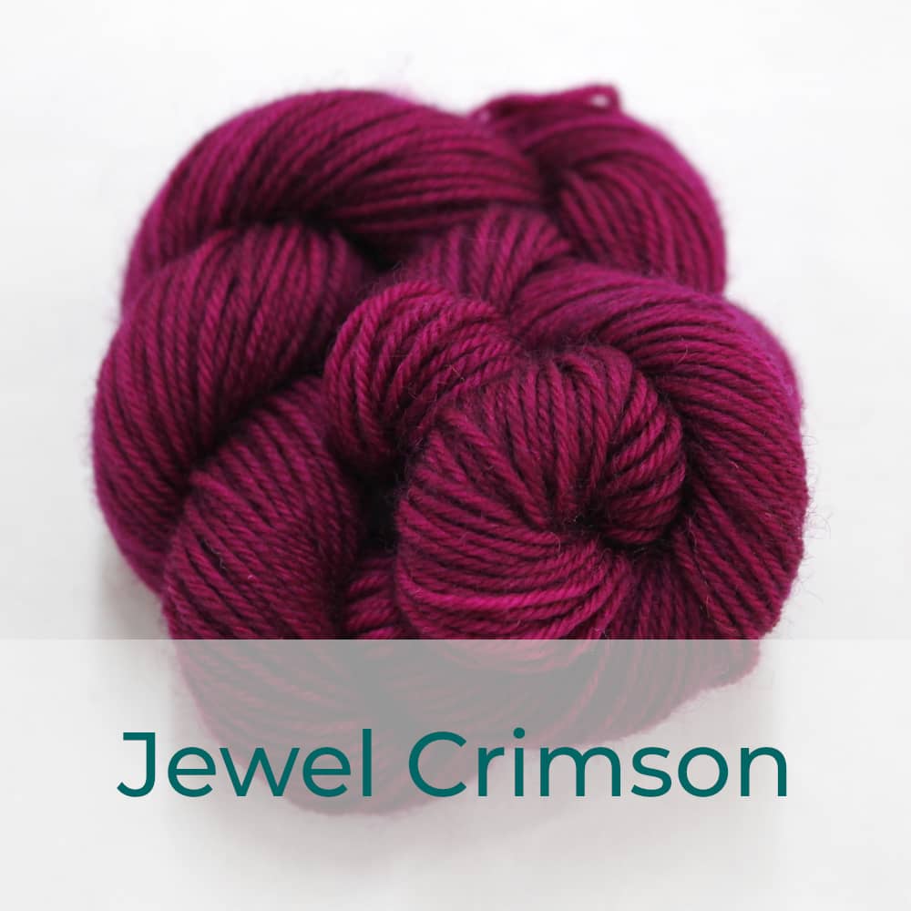 BFL 4 Ply mini skein in Jewel Crimson colourway. It is a deep pink.