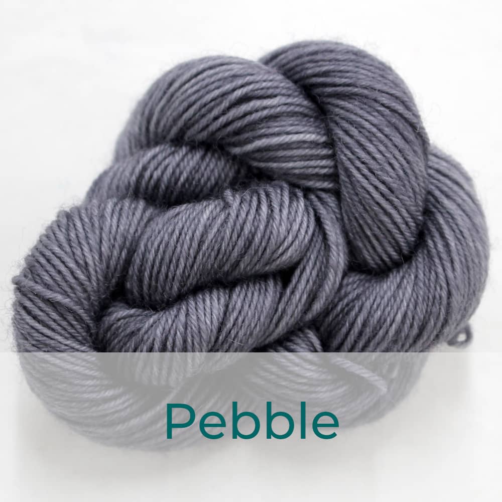 BFL 4 Ply mini skein in the Pebble colourway. It is mid grey.
