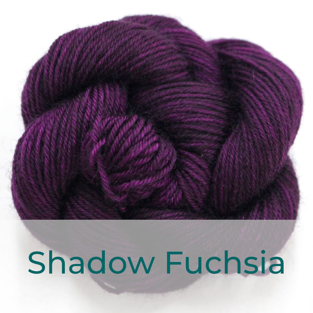 BFL 4 Ply mini skein in Shadow Fuchsia colourway. It is dark fuchsia purple.
