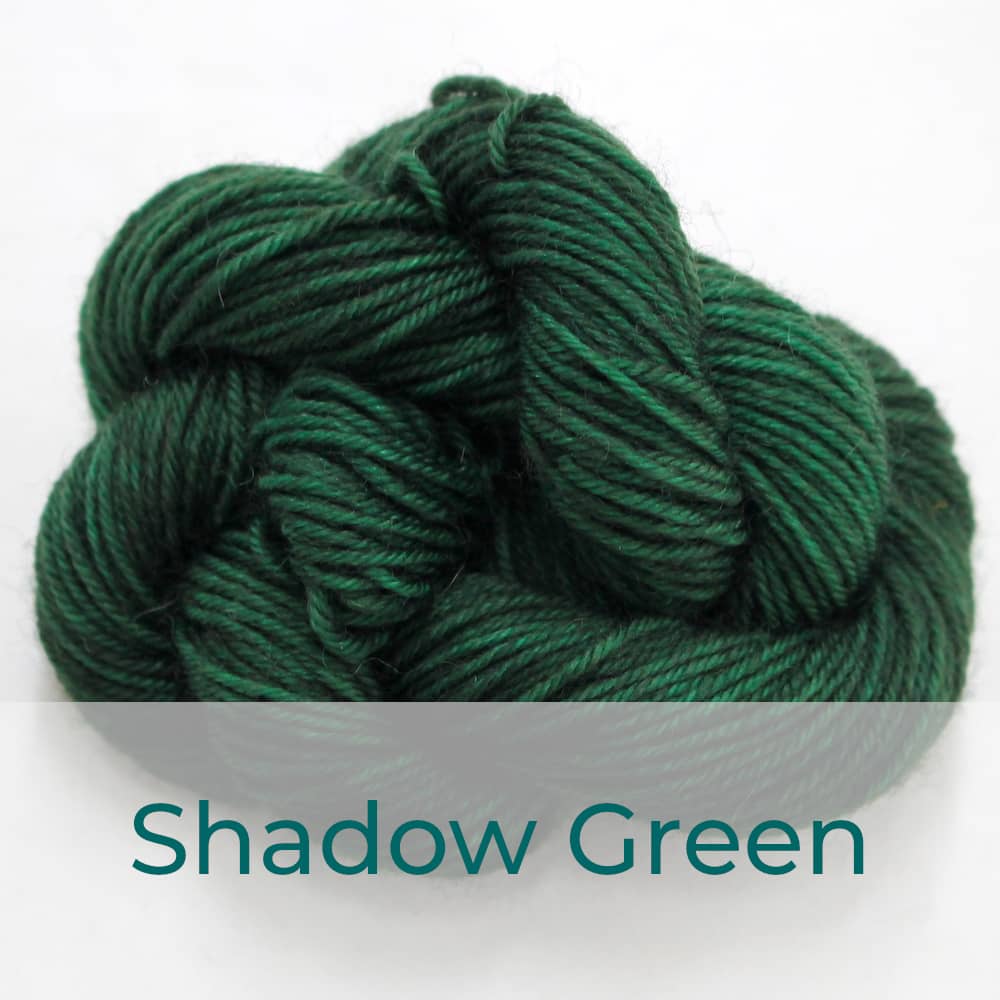 BFL 4 Ply mini skein in Shadow Green colourway. It is dark forest green.
