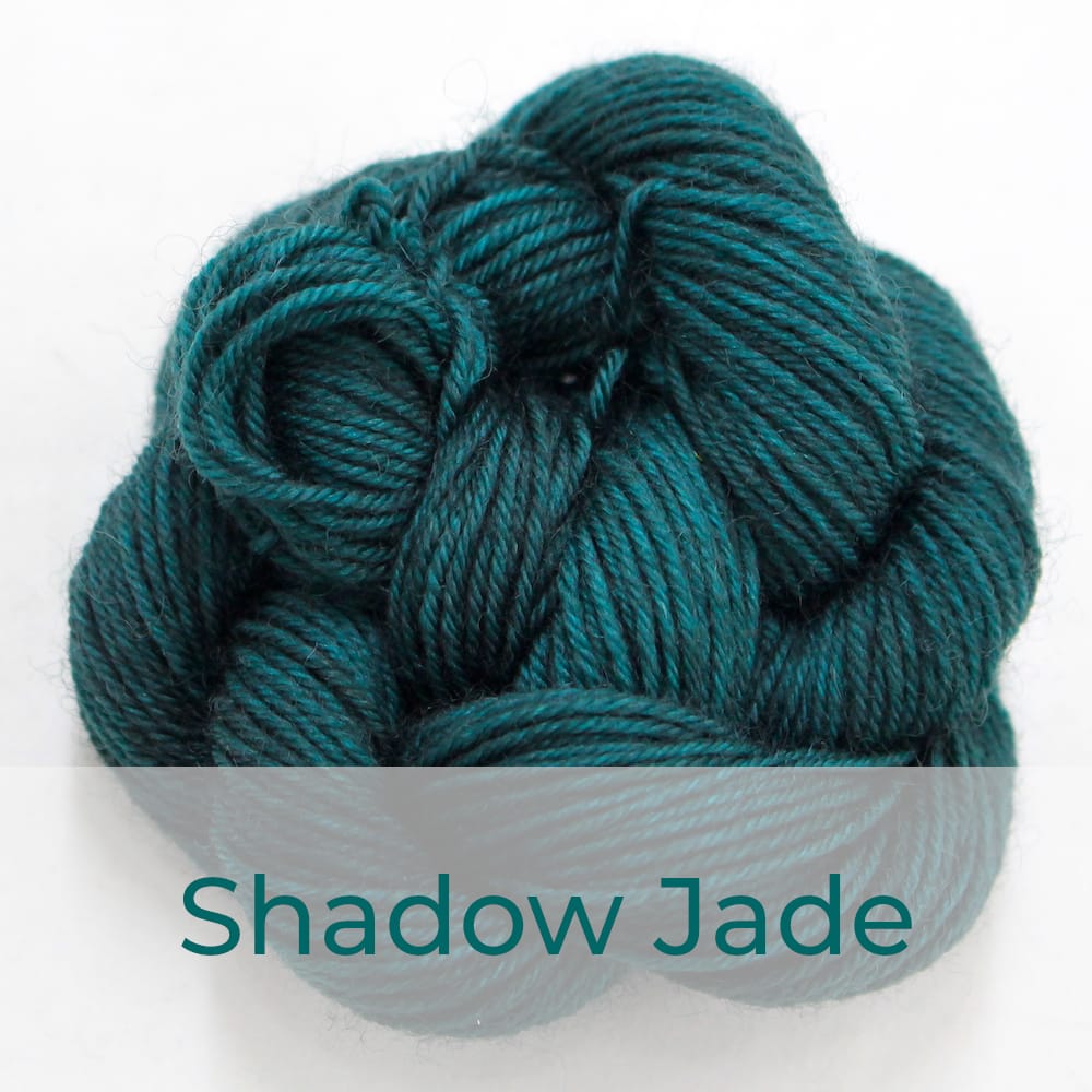 BFL 4 Ply mini skein in Shadow Jade colourway. It is dark jade green.
