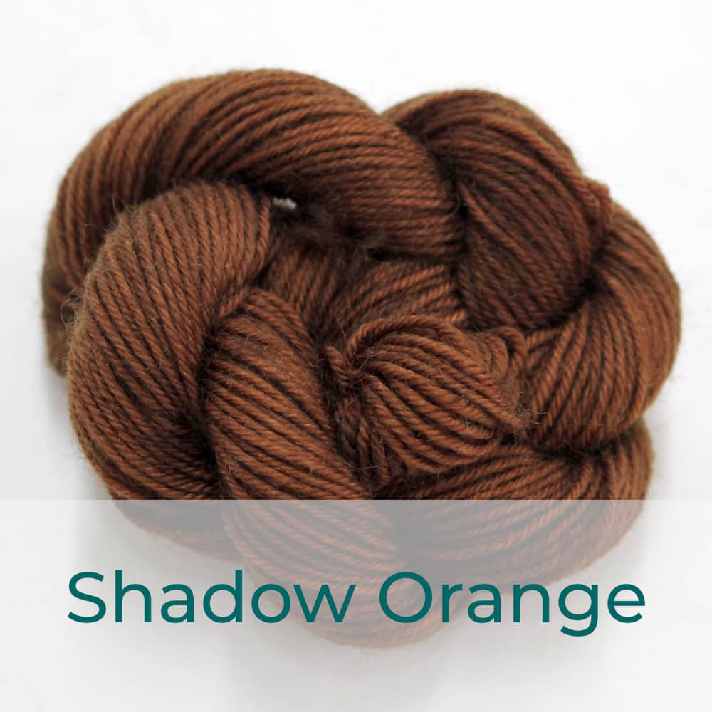 BFL 4 Ply mini skein in the Shadow Orange colourway. It is dark brown.