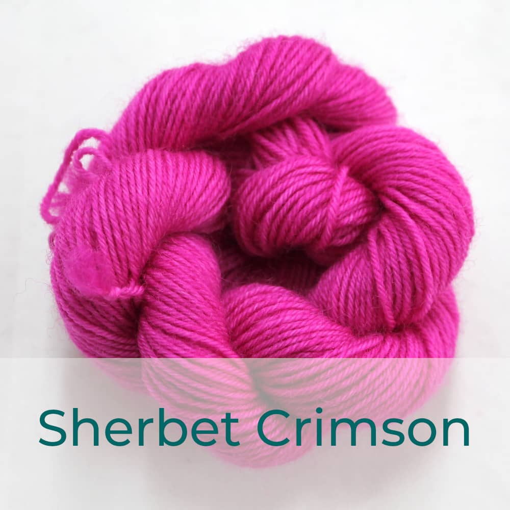 BFL 4 Ply mini skein in Sherbet Crimson colourway. It is bright pink.