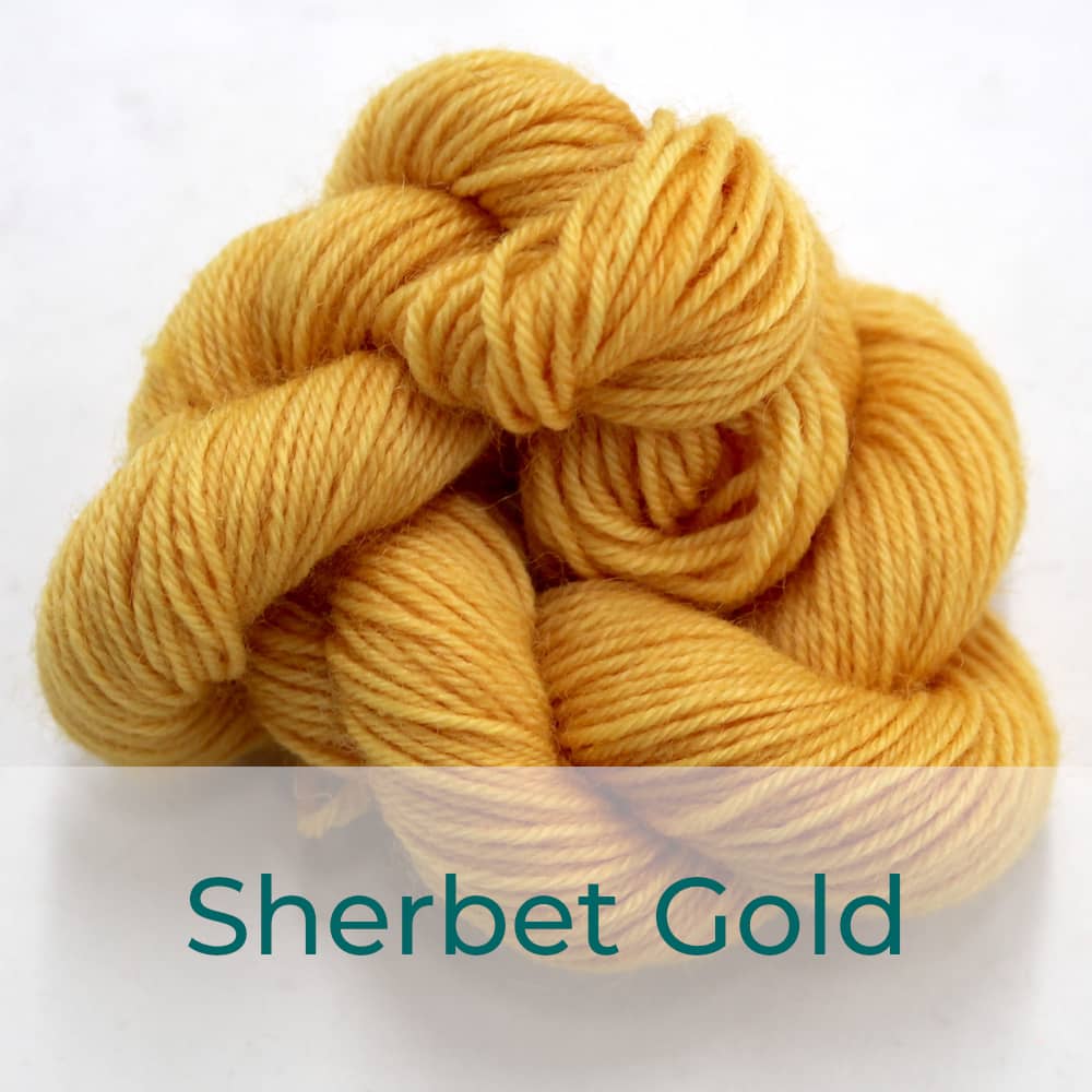 BFL 4 Ply mini skein in the Sherbet Gold colourway. It is pale orange-yellow.