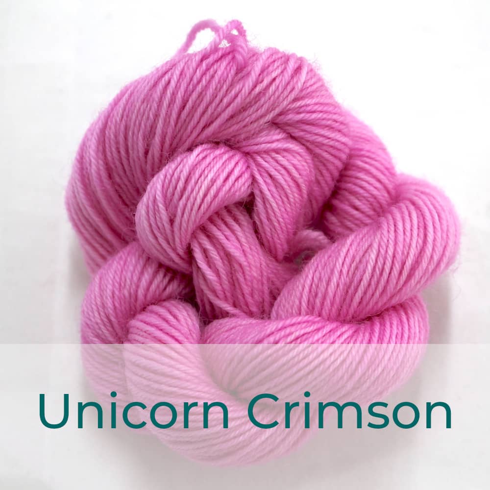 BFL 4 Ply mini skein in Unicorn Crimson colourway. It is light pink.