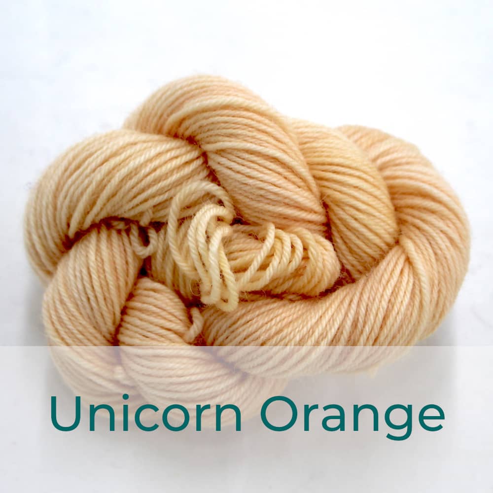 BFL 4 Ply mini skein in the Unicorn Orange colourway. It is light peach coloured.