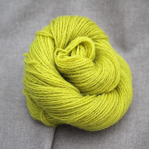 A skein of Severn 4 Ply in a chartreuse colour