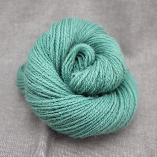 A skein of Severn 4 Ply in a pale teal colour
