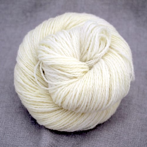 A skein of Severn 4 Ply in a natural ecru colour
