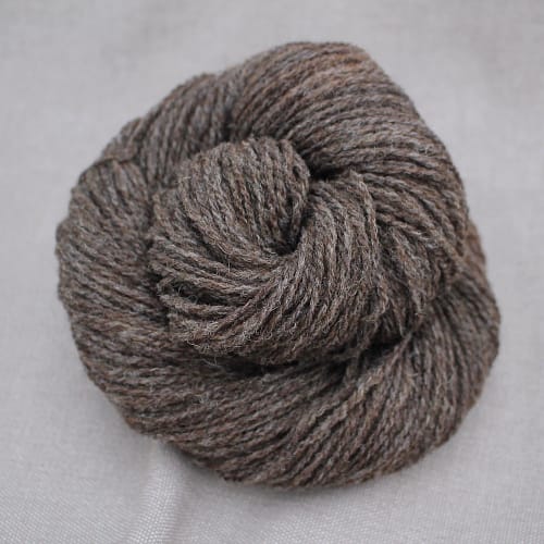 A skein of Severn 4 Ply in a naturally heathered brown colour