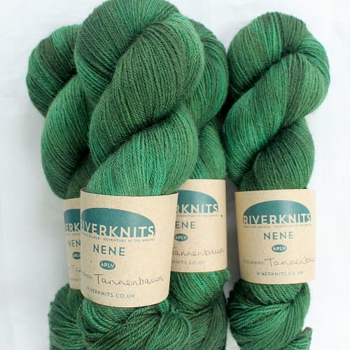 A pile of skeins of Nene 4 Ply in forest green