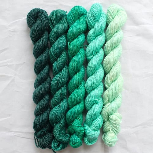 5 jade green mini skeins in a gradient from dark to light