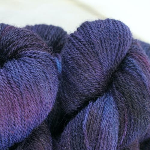 Dark purple yarn with hints of blue and plum