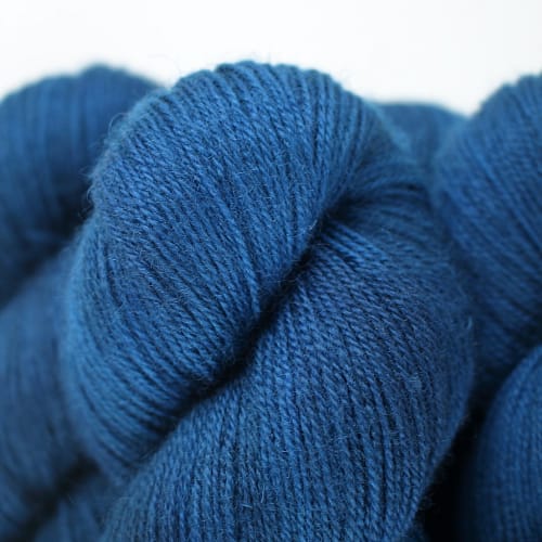 Close up of skeins in an intense peacock blue