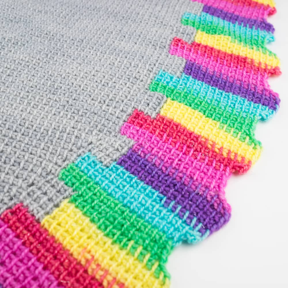 Close up of two colour Tunisian crochet shawl