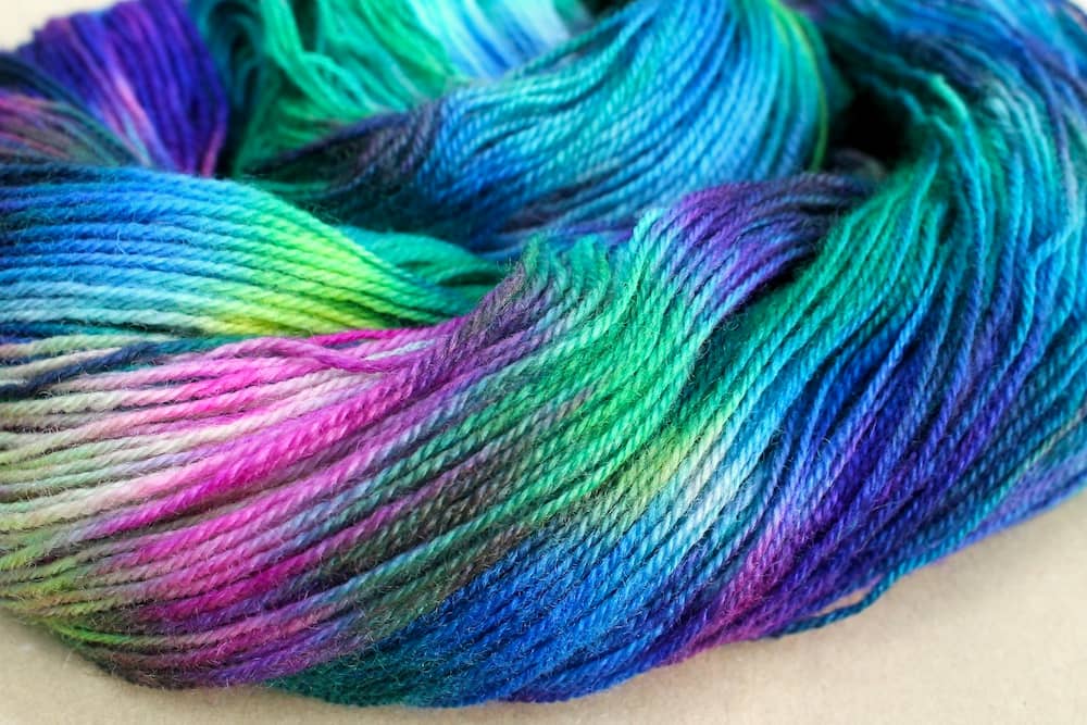 An undone skein of hand dyed variegated yarn