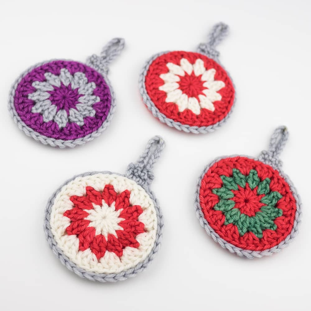 4 crocheted baubles in Christmassy colours
